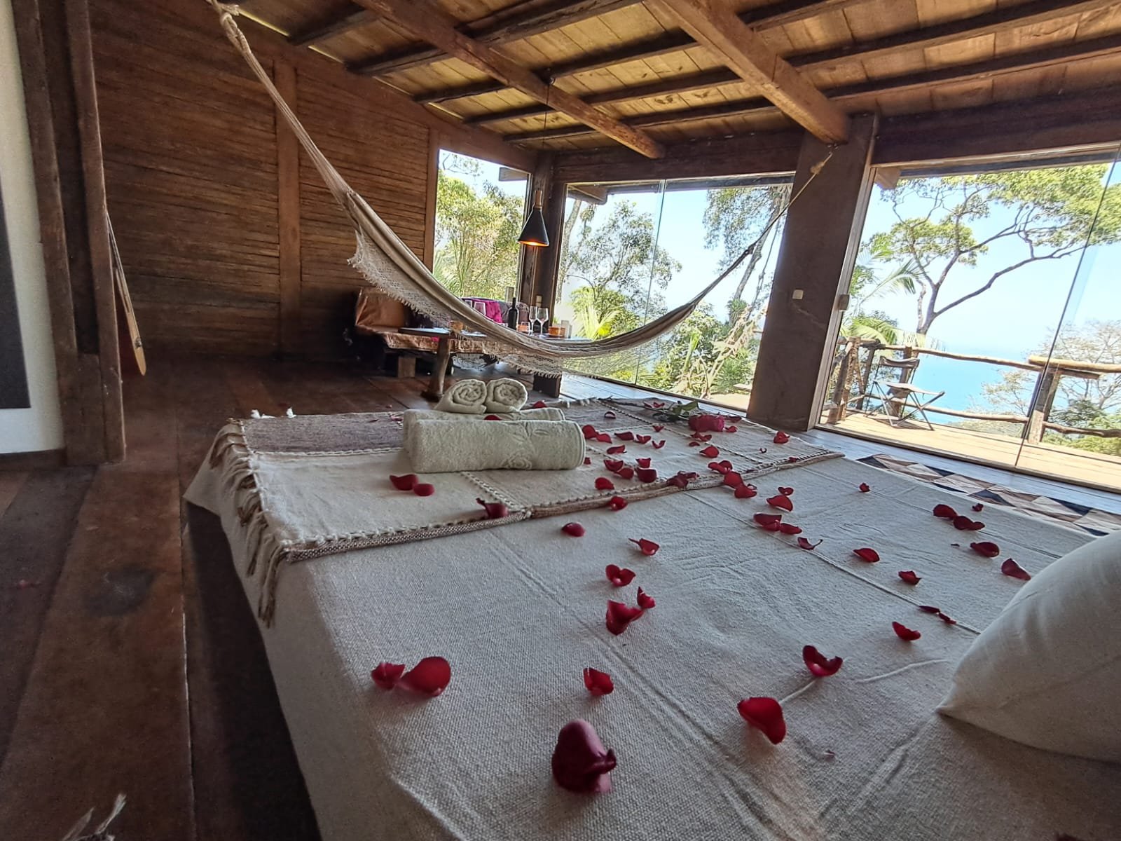 The bedroom, with the terrace and the sea beyond